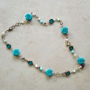Handmade necklace with blue roses